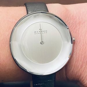 Skagen watch with metallic leather band.